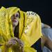 Senior Tracey brown uses a poncho to stay dry while watching the game against Alabama on Saturday. Daniel Brenner I AnnArbor.com
